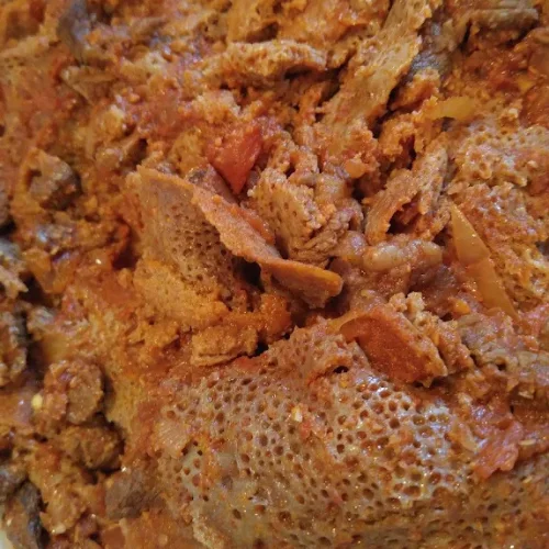 Quanta Firfir - Dried beef strips mixed with injera and spiced butter