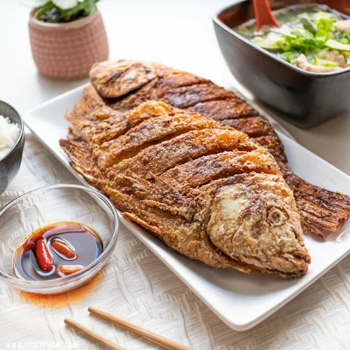 Whole Fried Tilapia - Whole fried tilapia served with Habesha salad